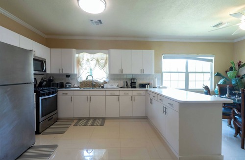 Northwest Point House | Delightful 3-bedroom house with AC in West Bay. Walkable to the public beach.