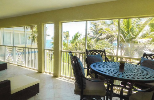 North Side Condo | Hello Sunshine! Beachfront 2BR 2BA condo Retreat Rum Point w/GYM, Tennis, &WiFi