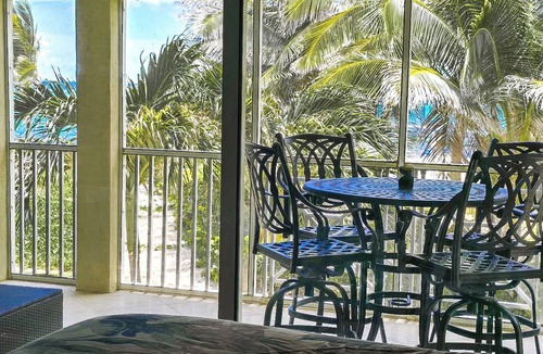 North Side Condo | Hello Sunshine! Beachfront 2BR 2BA condo Retreat Rum Point w/GYM, Tennis, &WiFi