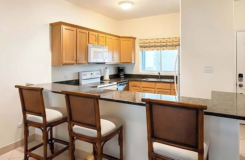 Rum Point Apartment | Kaibo Yacht Club 2 Bdr Beachfront Condo Hot Tub and Pool