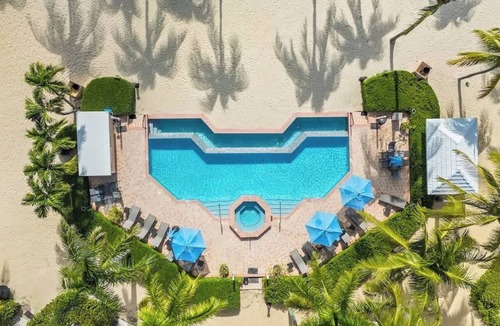 Rum Point Apartment | Kaibo Yacht Club 2 Bdr Beachfront Condo Hot Tub and Pool
