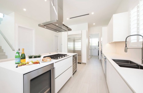 Northwest Point House | Oceans 9: Seaside Lazy River Pool, Sunken BBQ Ocean Lounge + Designer Interiors in West Bay