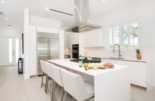 Northwest Point House | Oceans 9: Seaside Lazy River Pool, Sunken BBQ Ocean Lounge + Designer Interiors in West Bay