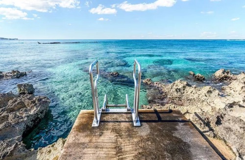 Seven Mile Beach Condo | Seven Mile Beach Sea View Sunsets steps to water Ground Floor pool at front door
