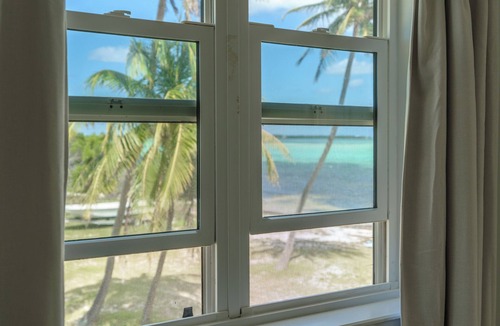 Blossom Village Villa | Sonny's Place - Beachfront Two-Bedroom Villa- Wake up to the sound of the waves
