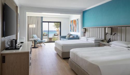 Junior Suite with Two Double Beds Oceanfront View  and Balcony